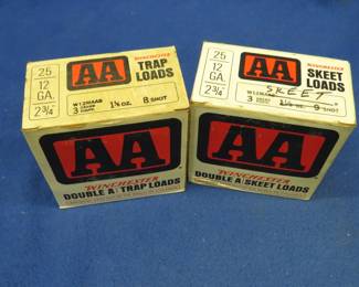 Lot 218. Two vintage AA shotgun shell boxes. Each box contains 25 AA 8-shot shotgun shells. These shells may be reloads. AS-IS. Use at your own risk.