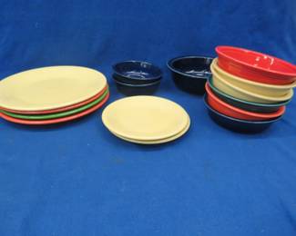 Lot 307. Fiesta Ware in multiple colors. Two sizes of plates and three sizes of bowls.