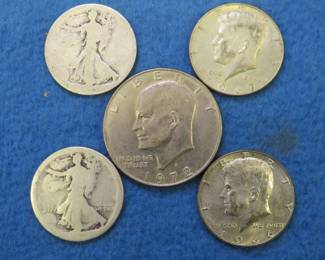 Lot 89. Two unreadable Walking Liberty Half Dollars, two 40% Silver Kennedy Half Dollars, and one 1972 Eisenhower Dollar Coin