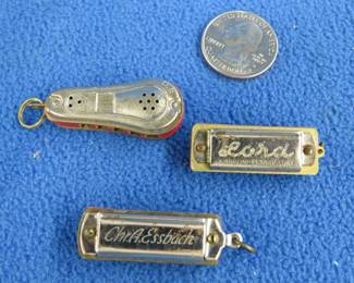 Lot 170. Three vintage miniature harmonicas: C. H. Meinel-Schlossmeinel 5-hole Ballon Brand harmonica. Chr.A.Essbach ECHTE 5-hole harmonica. A. Mancini Lord 5-hole.