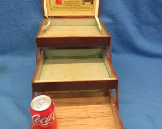 Lot 139. Hohner's World Renowned Harmonicas wooden three-tiered box. Closed dimensions are 10 1/2"W x 6"H x 9 1/4"D. Top is cracked. Minimum bid $20.