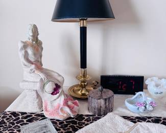 Art Deco brass and black table lamp, crystal trinket box, vintage beaded purses, Austin sculpture