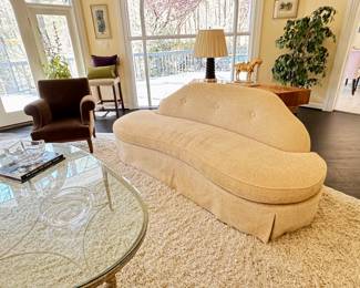 PAIR of curved armless sofas upholstered in a bone colored silk and cotton chenille. 7'6" L x 39" D x 35" H