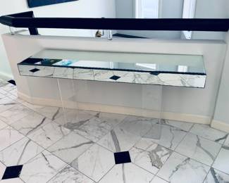 Console with mirrored tabletop on acrylic legs