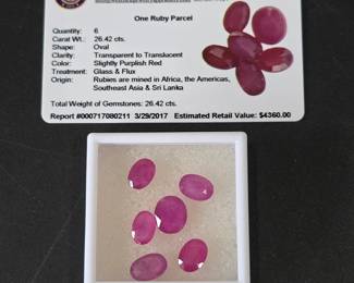 Lot #9 - 26.42 Ct Oval Ruby Parcel - Purplish Red Transparent Rubies With Glass & Flux Treatment - Plus Gem Appraisal Card