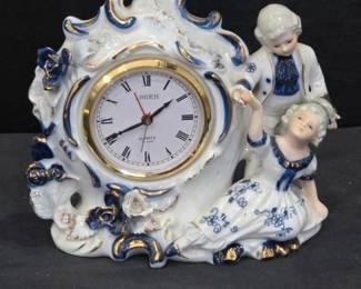 Lot #143 - Vintage Linden Porcelain Figurine Clock with Boy and Girl Dancing Design, Blue and Gold Accents