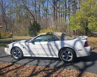 2004 Mustang, 142,000 miles, 40th anniversary, convertible top.