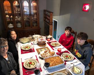 Dining table and hutch showing crystal and china