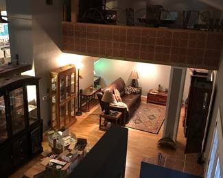 Shown are oak & glass curio and wood & glass bookcase