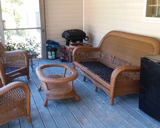 Wicker porch furniture without cushions or glass in tables