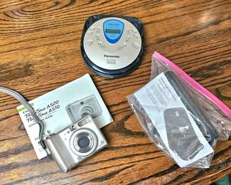 Vintage Canon PowerShot digital camera/Panasonic portable CD player.