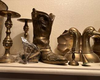 Brass candlesticks, brass bells, brass boot, brass bookends