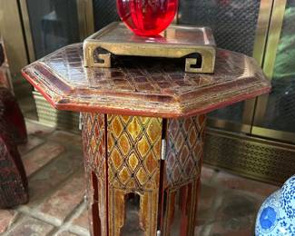 Small wood and lacquer octagonal table, lucite apple, brass trivet