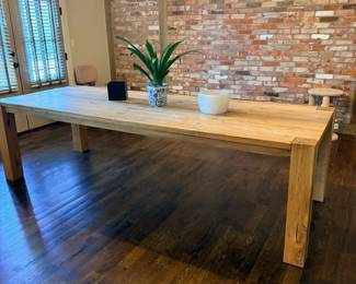 Dining room view with farmhouse table and modern chandelier