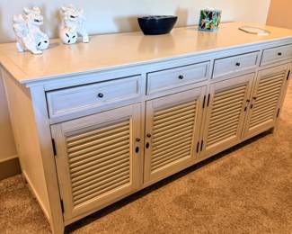 Whitewashed wood sideboard / credenza with louvered doors