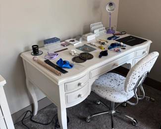 White writing desk with decorative cabriole legs and upholstered chair