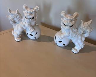 Pair of white porcelain Chinese foo dog guardian lions