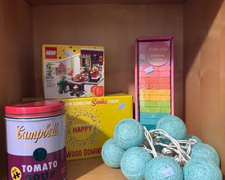 LEGO set, wood dominoes, Campbell's collectible tin, decorative spheres