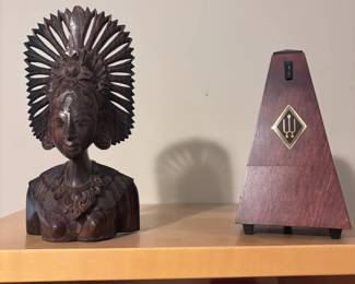 Carved wood African tribal bust and vintage metronome