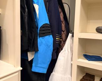 Pilot uniform shirts and jackets in closet