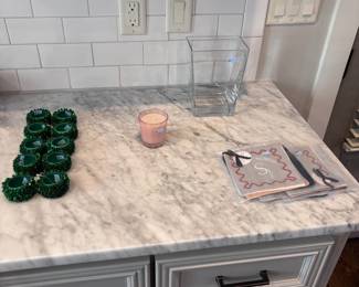 Kitchen counter with green napkin rings and cutting board