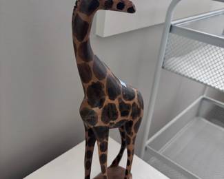 Hand-carved wood giraffe sculpture, side view