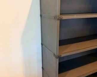 Industrial metal bookshelf detail - riveted edges