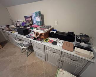 Office / craft room with built-in desk and assorted supplies