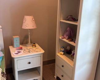 White nightstand and tall white bookcase