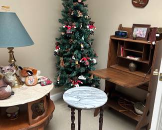 Marble top plant stand.   Christmas Tree with Fox ornaments . Table marble top