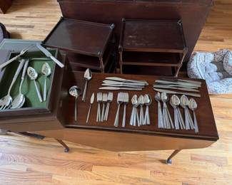 Stainless flatware set and serving pieces in case