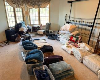 Floor rugs, sleeping bags, air mattress, towels, luggage, antique end table
