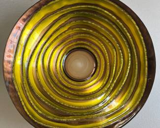 Large purple/yellow metal bowl.