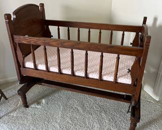 Vintage wooden baby rocking cradle.
