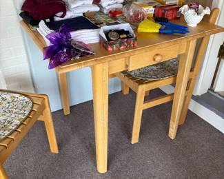 Oak table with two chairs.