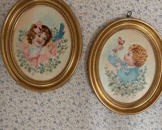 Vintage framed art prints featuring classic children’s portraits.