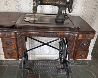 Antique White Rotary sewing machine and cabinet.