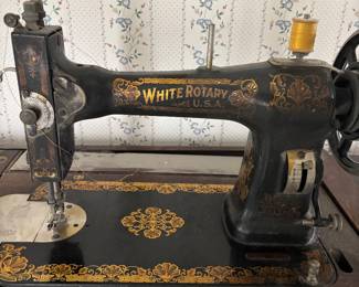 Antique White Rotary sewing machine and cabinet.