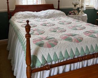 Full-size bed with mattress and box spring.