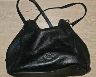 A black pebbled leather Coach Hallie shoulder bag with silver hardware.