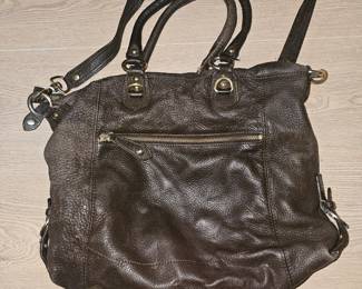A dark brown pebbled leather slouchy handbag by Pelle Studio.