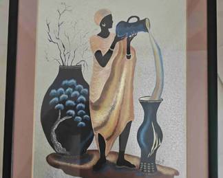 A framed 1990s Dufex foil art print of an African woman pouring water