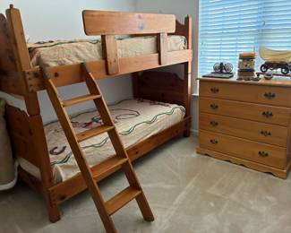 Vintage wooden bunk beds with ladder