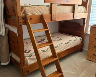Vintage wooden bunk beds with ladder