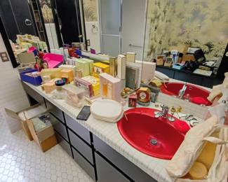 This amazing foil-wallpapered, black lacquered, red-sinked bathroom holds every kind of perfume and cosmetic you could dream of! Most are unopened and new old stock!