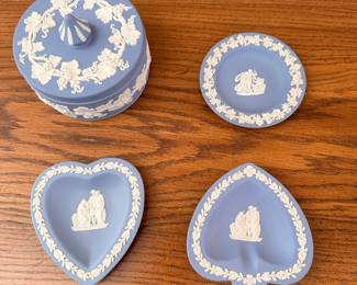Vintage Wedgwood Blue Jasperware trinket boxes and dishes featuring white neoclassical relief decorations. The collection includes a lidded round box adorned with a white grape vine pattern. It also features heart-shaped dishes showcasing classical figures. These decorative stoneware pieces were typically produced by Josiah Wedgwood & Sons in England. Wedgwood Blue Jasperware Trinket Round Box 4 7/8" Grape ... - eBay On offer is one of blue Wedgwood's jasperware's decorative round trinket boxes. As with most Jasperware stoneware the dish is a li... eBay Vintage Wedgwood Round Trinket, Jewelry, Keepsake Lidded Box ... This little lovely features a round lidded box with highly detailed white grape vines around the sides and on the lid. Wedgwood is... Etsy Blue With White Detail Wedgwood Jasperware with Neoclassical relief decorations.