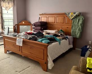 Kincaid King Bed - filled with clothes, gloves, scarves