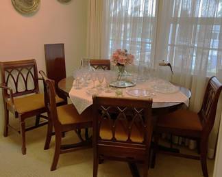 This is the dining room table (with leaf) and five matching chairs.