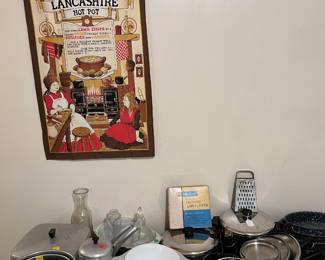 A few kitchen mixing and serving bowls can be seen here.