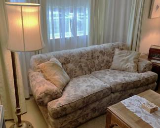 One of the two sofas in the sale is here, along with the coffee table and floor lamp.